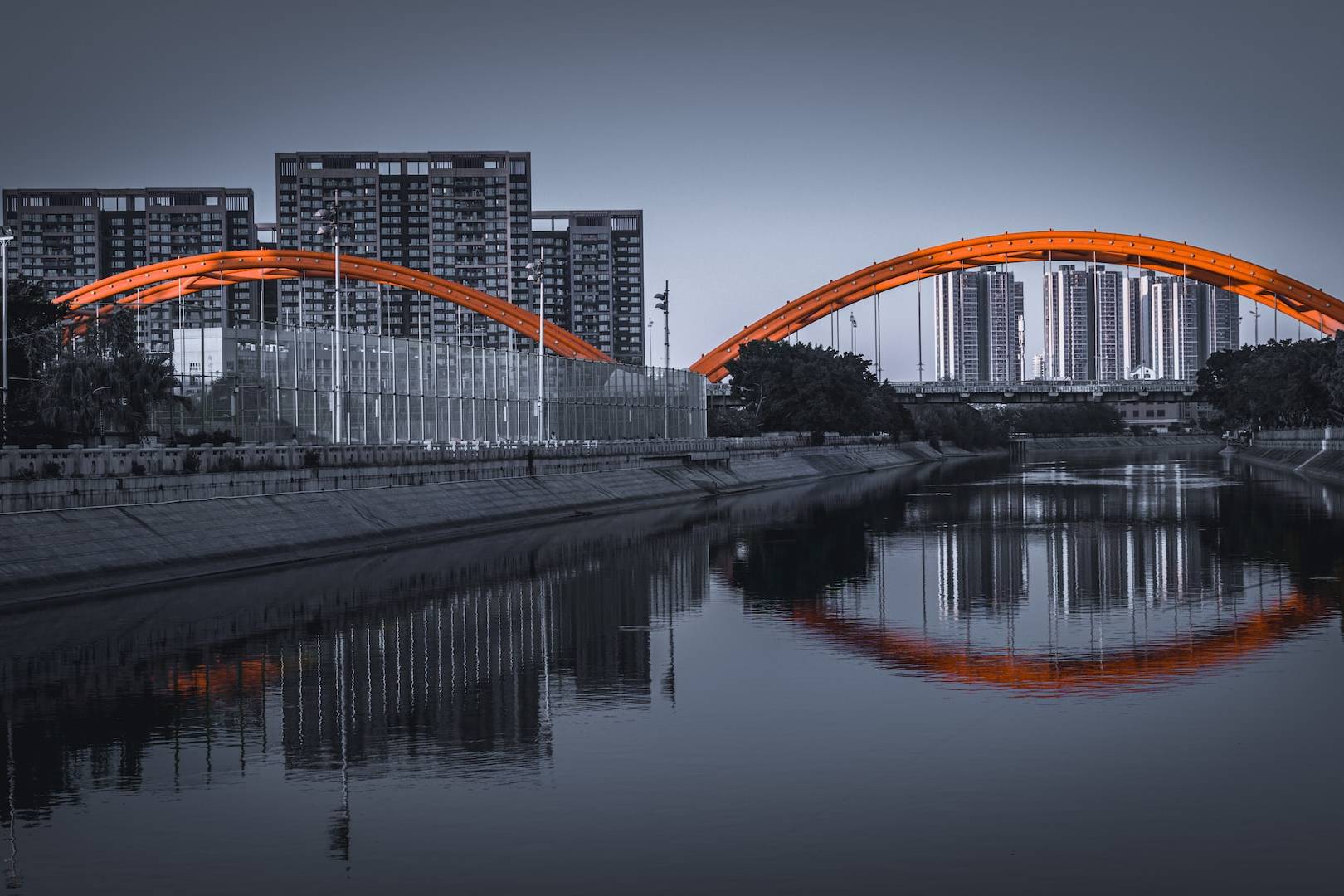 orange and white bridge over river