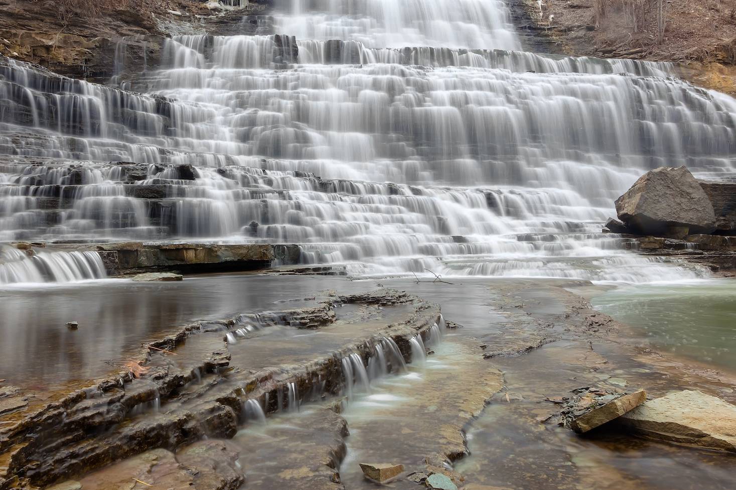 time-lapse photo of layered waterfalls