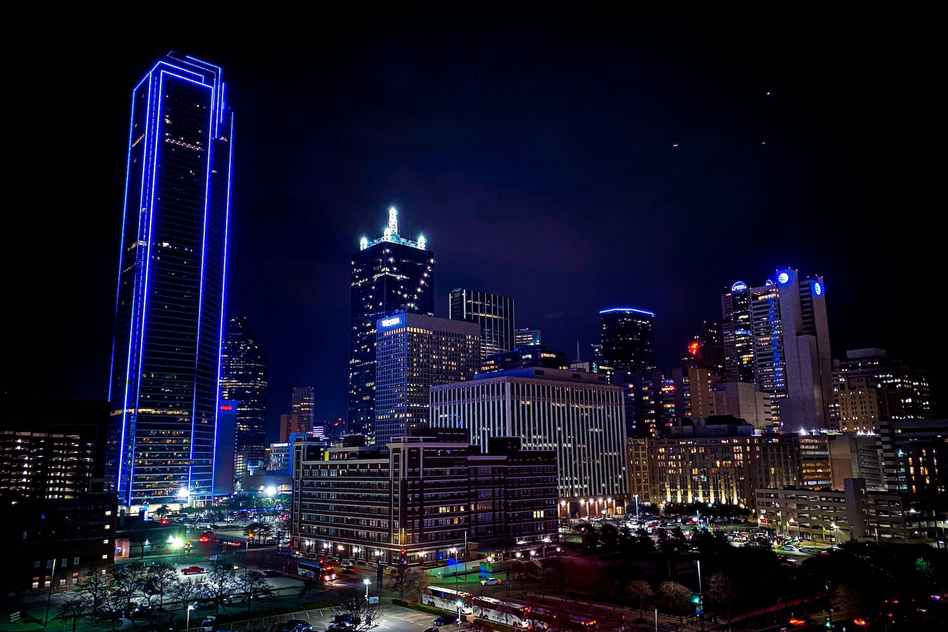 aerial photography of city with high-rise buildings during night time