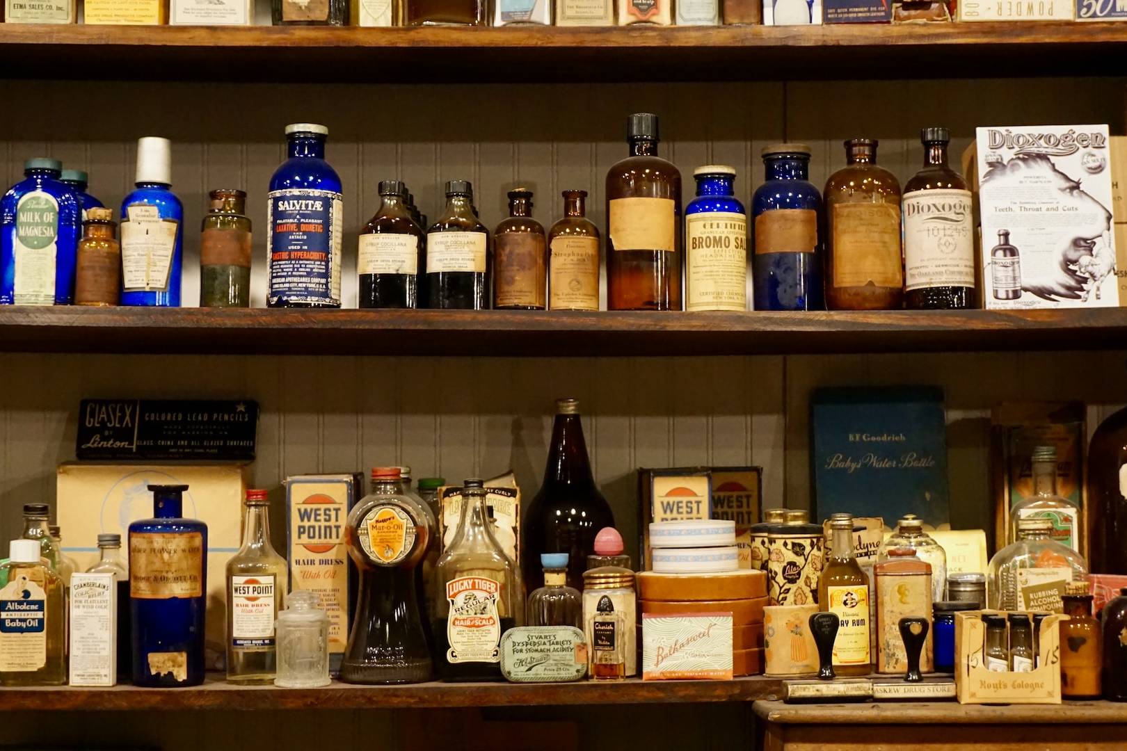 a shelf filled with lots of different types of liquor