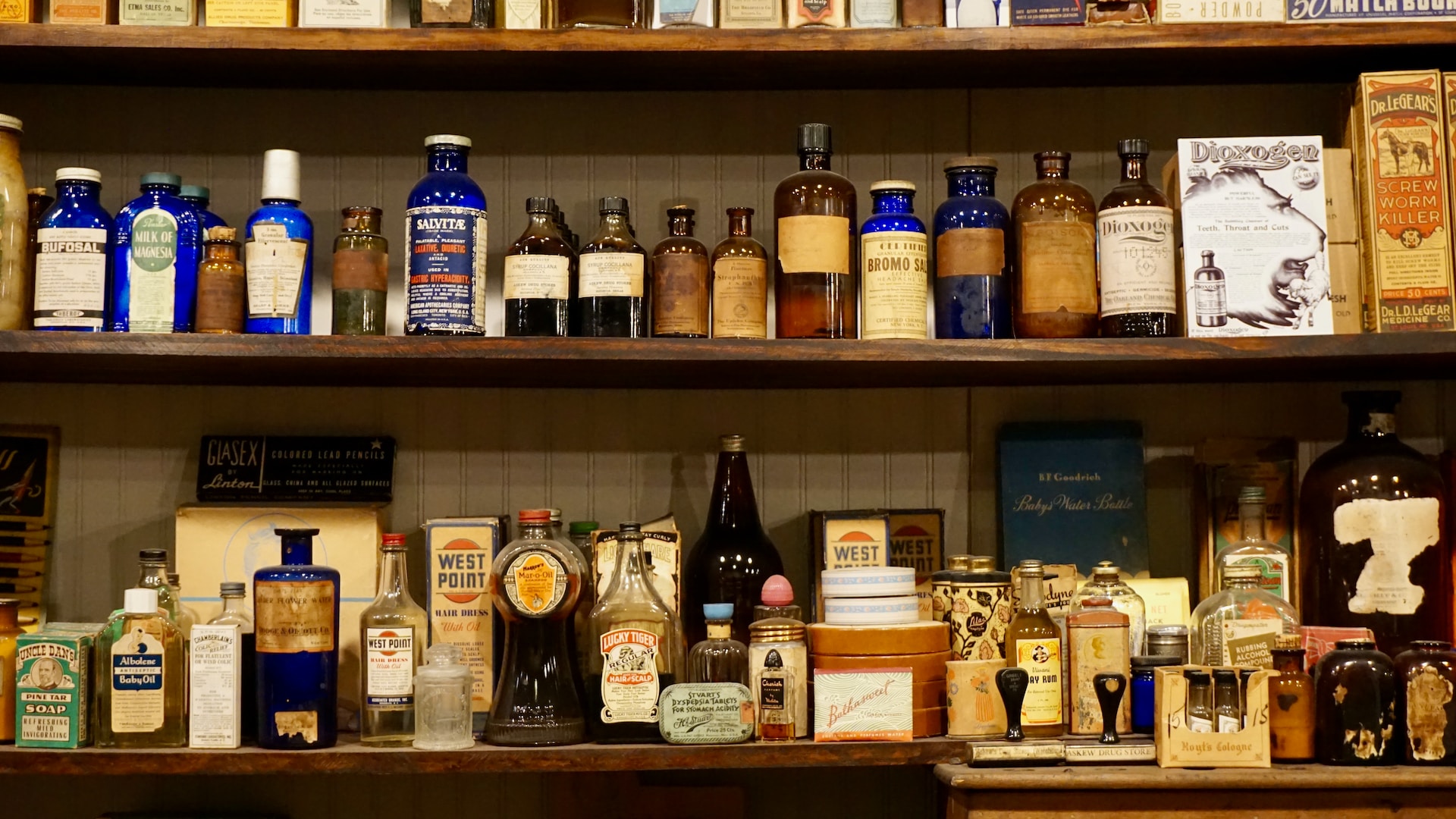 a shelf filled with lots of different types of liquor
