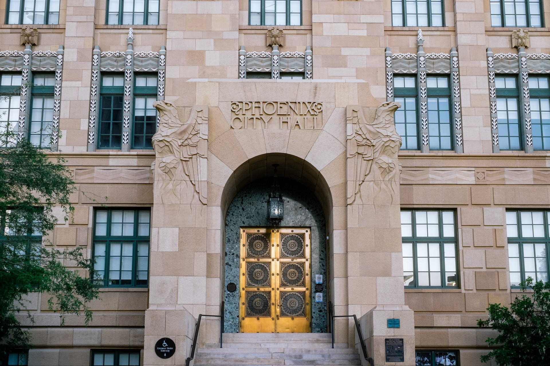 brown concrete building with gold door lever