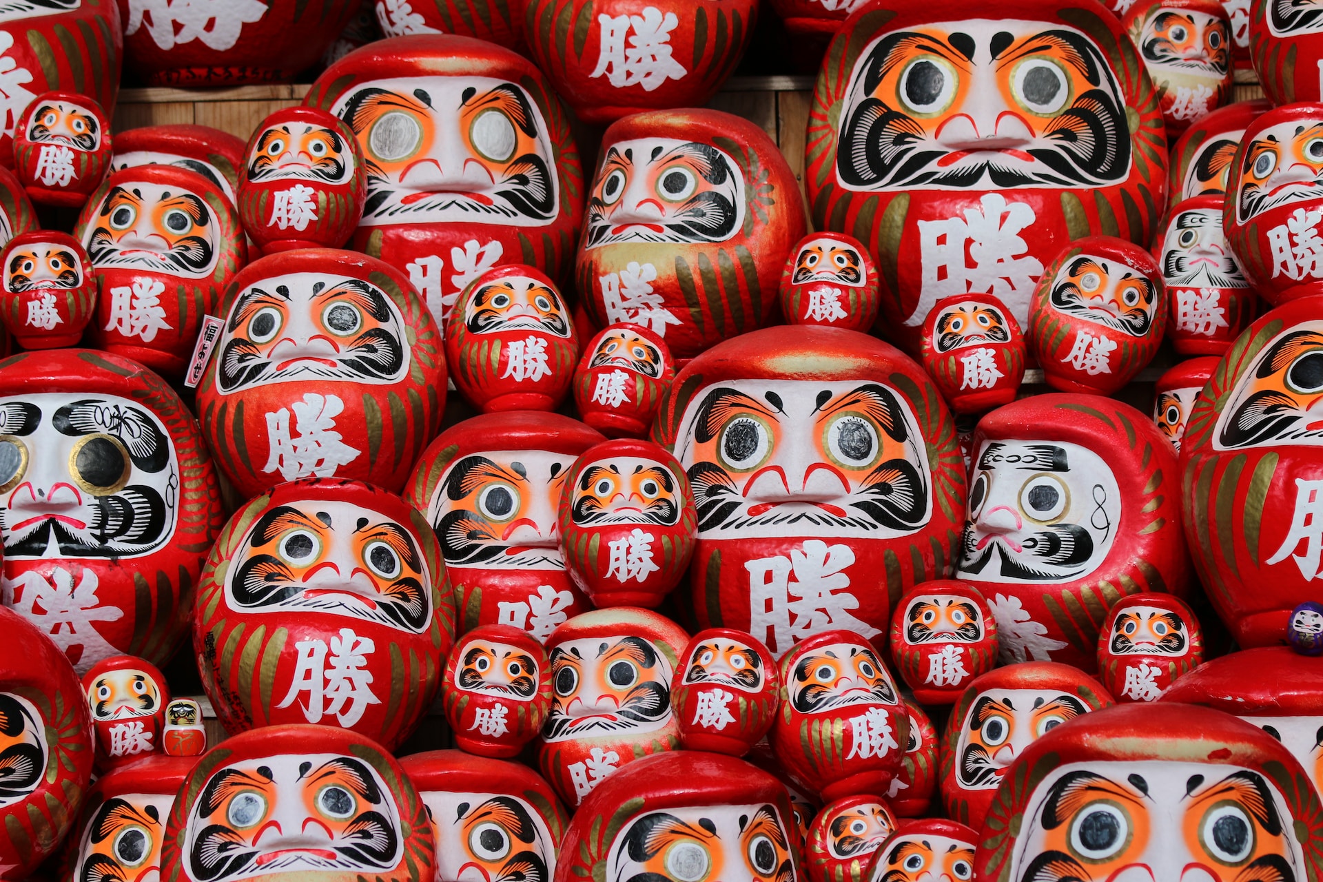 red-and-white daruma dolls
