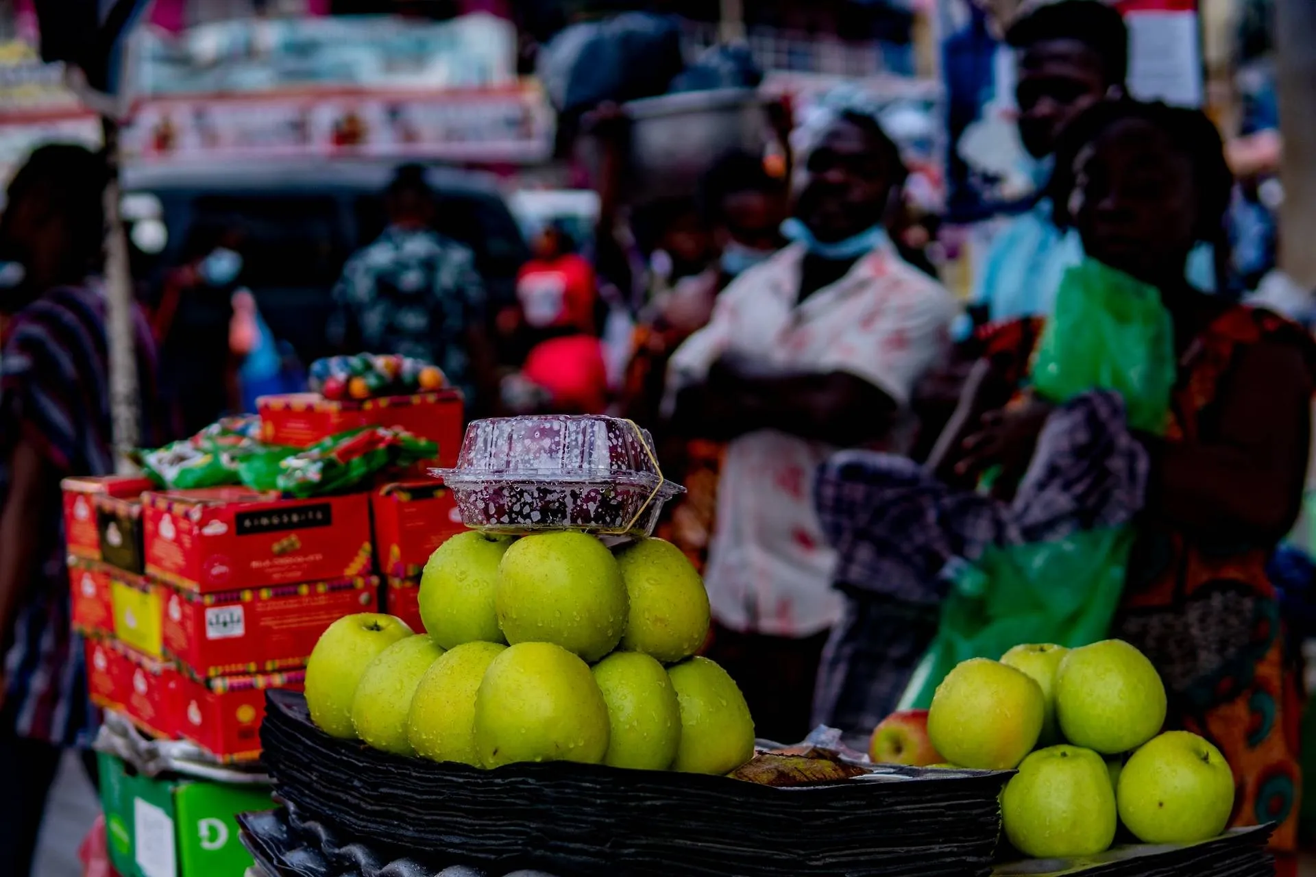 green apples on black plastic basket