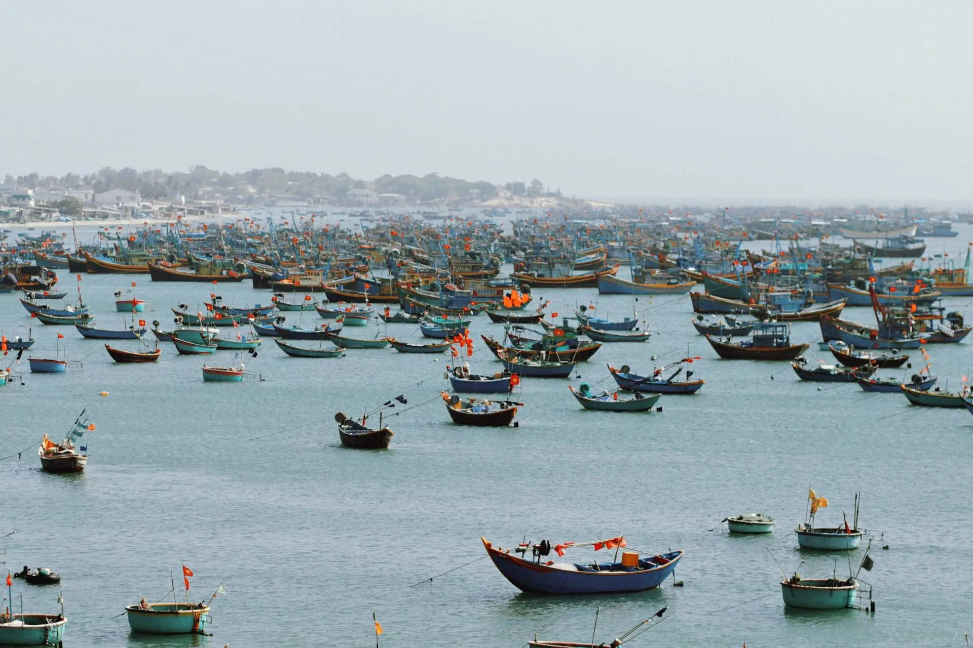 red and white boat on sea during daytime