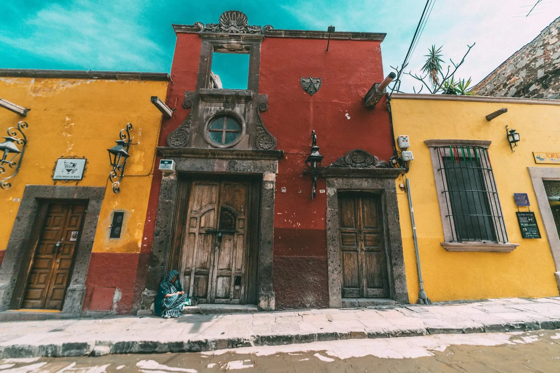 three assorted-color painted house in worm's eye photography