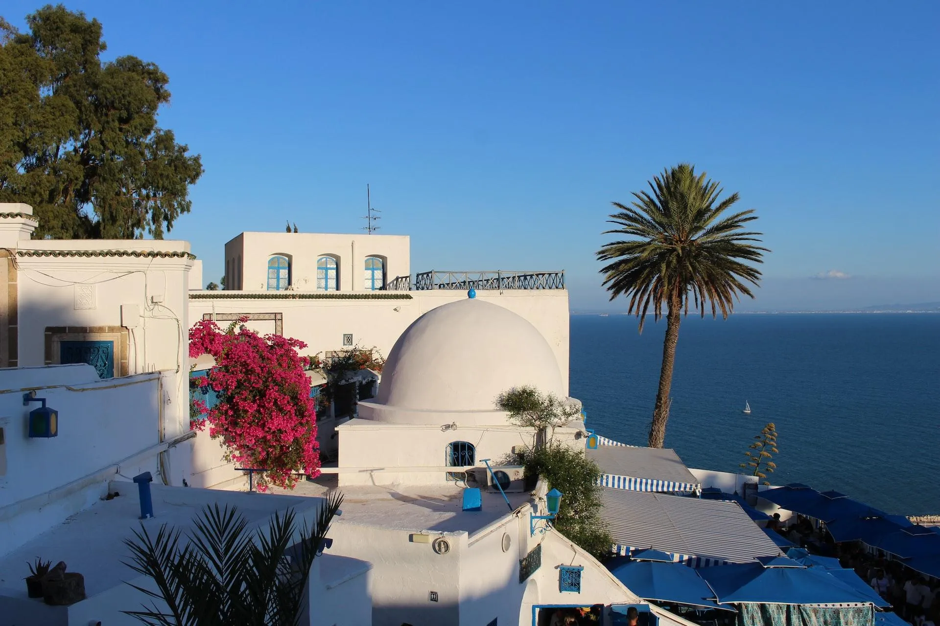 white concrete building near body of water during daytime