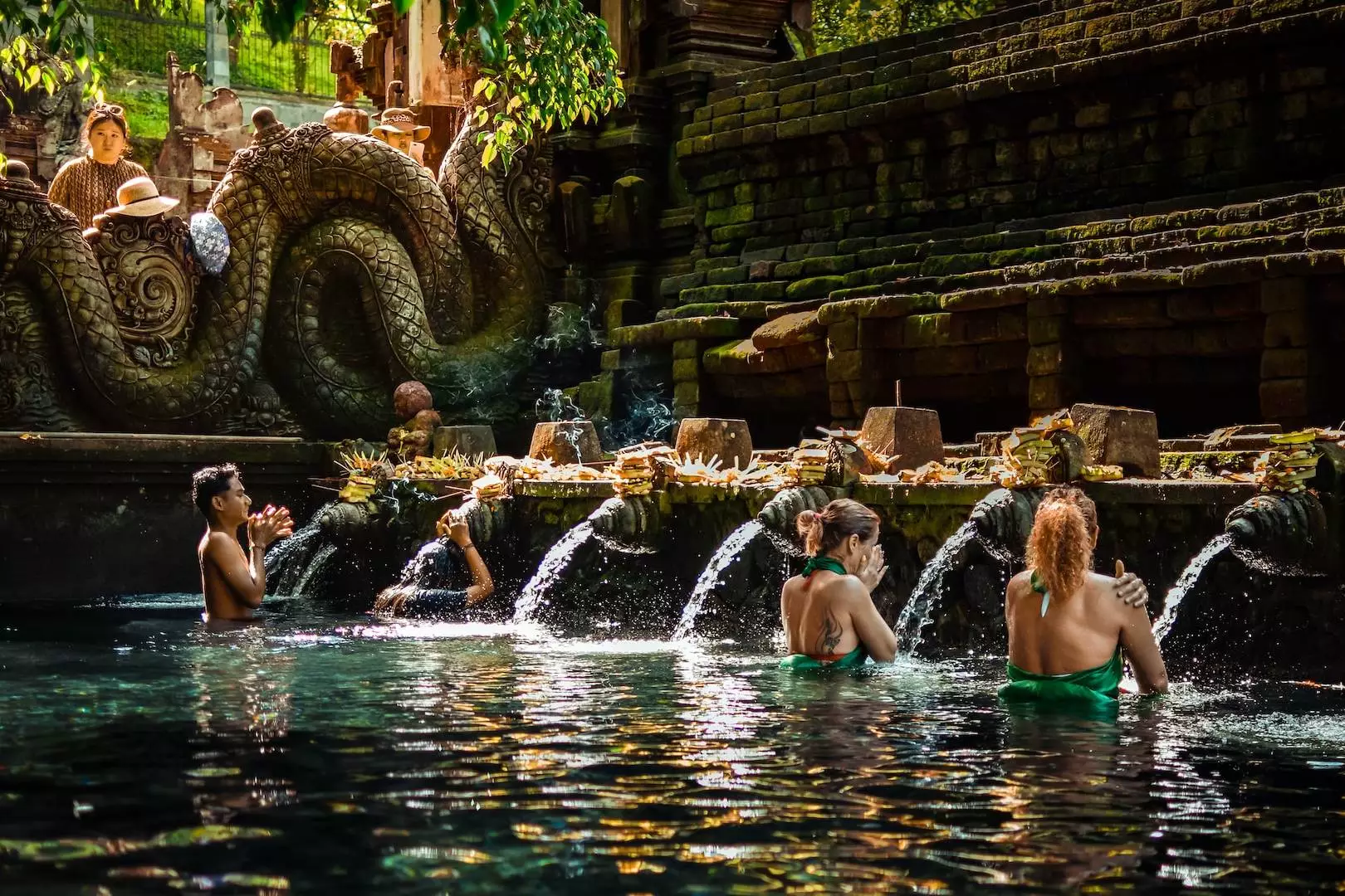 a group of people sitting in a pool of water