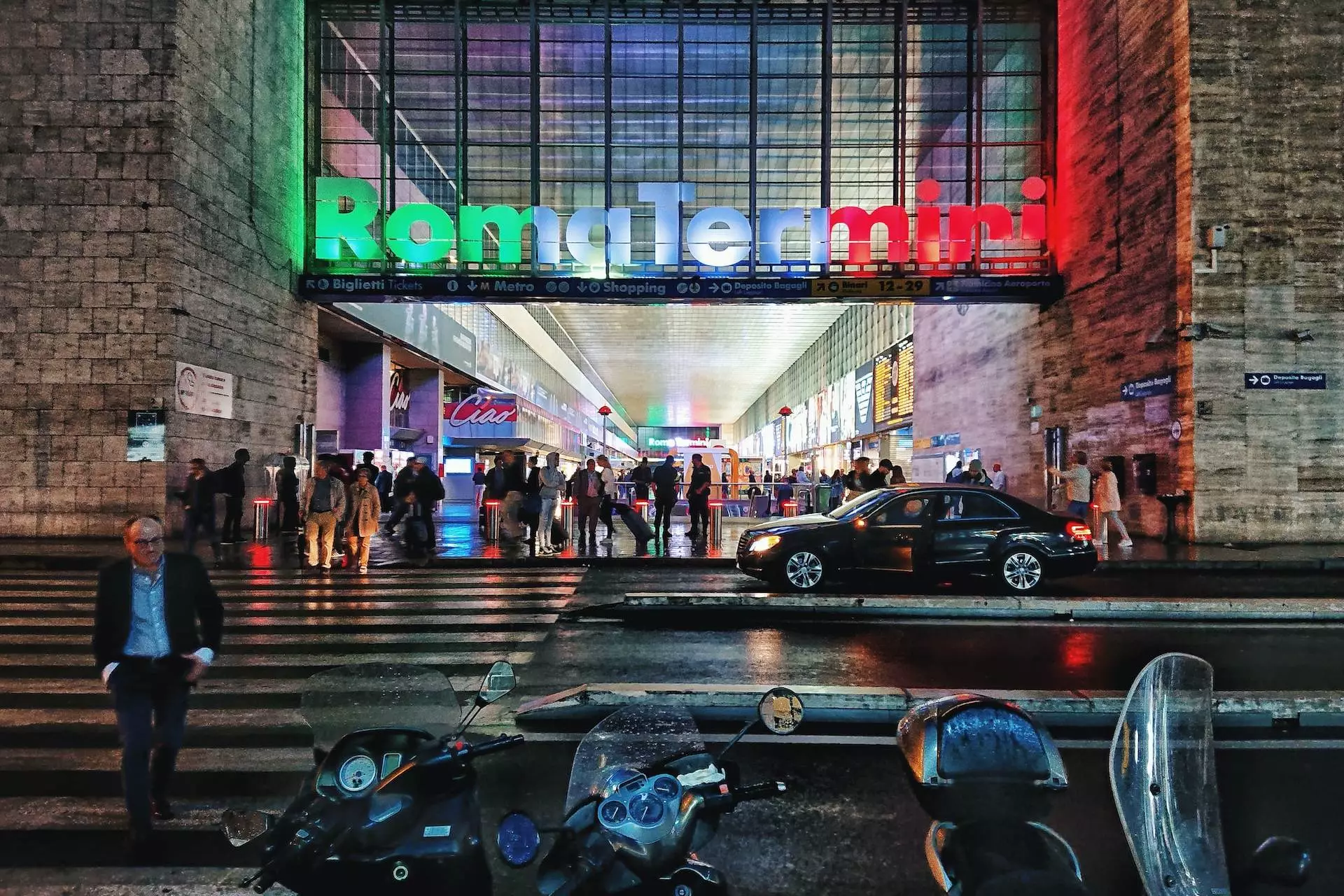 motorcycles across RomaTermiri lighted signage