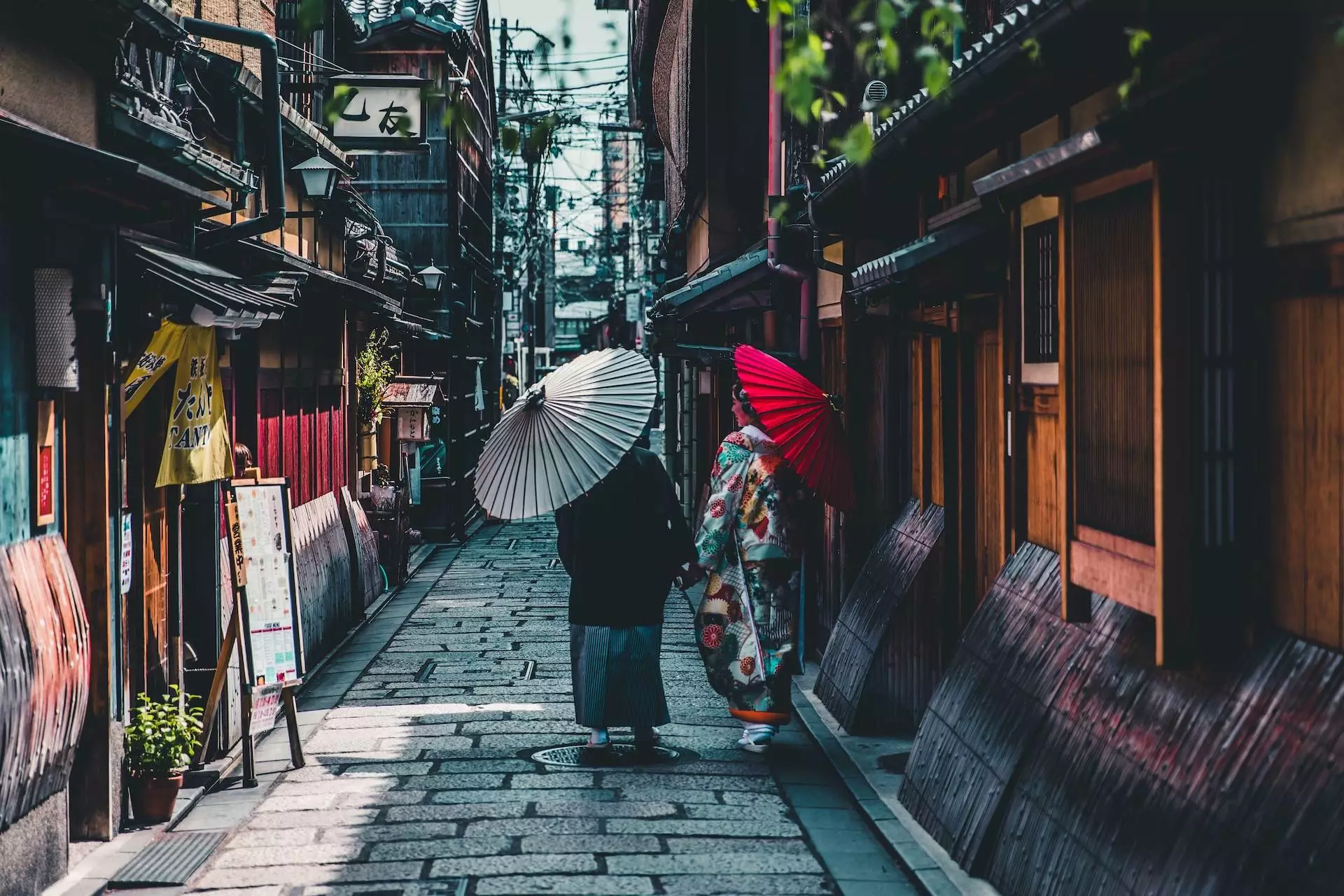 person walking on street while holding umbrella