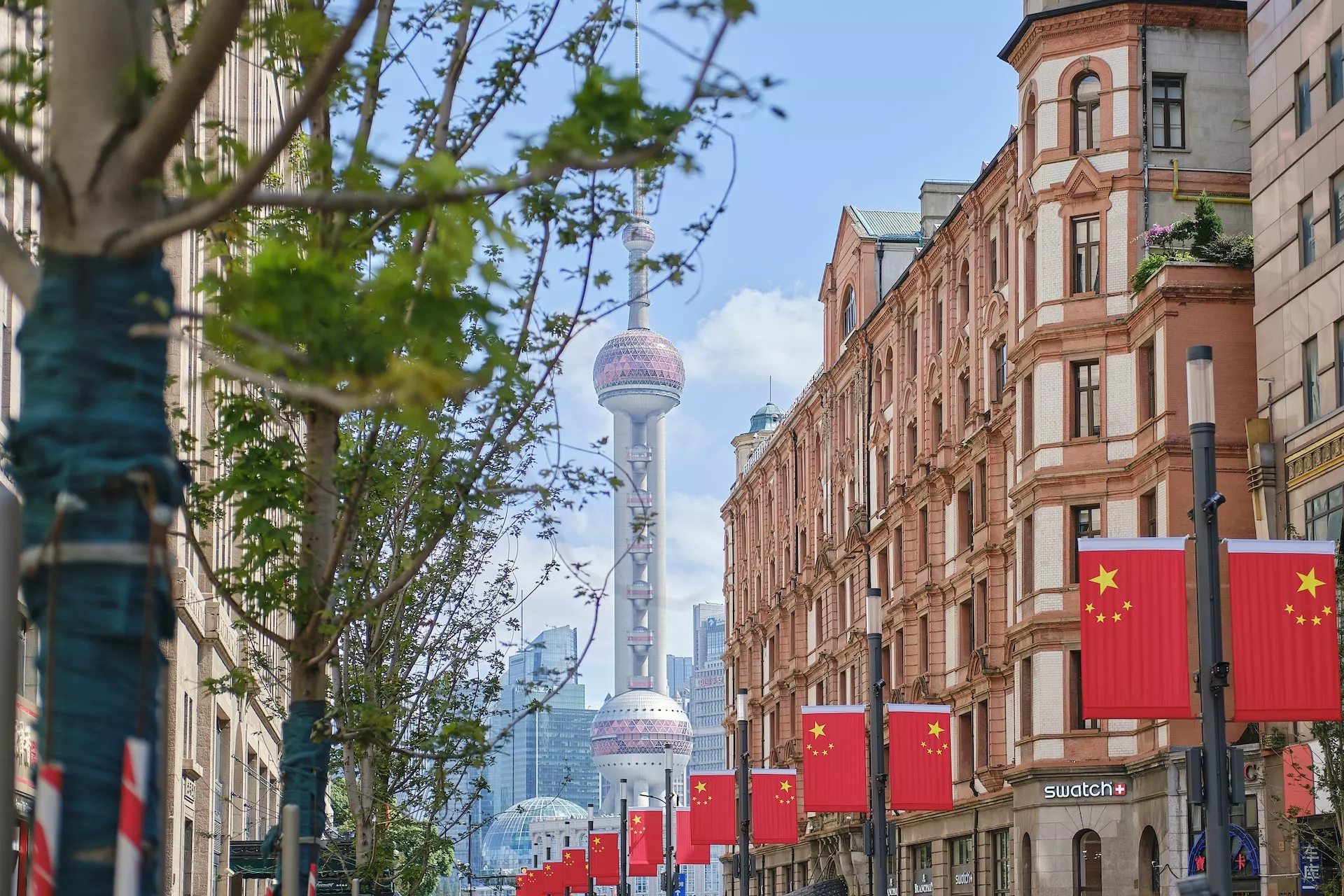 brown concrete building near green trees during daytime