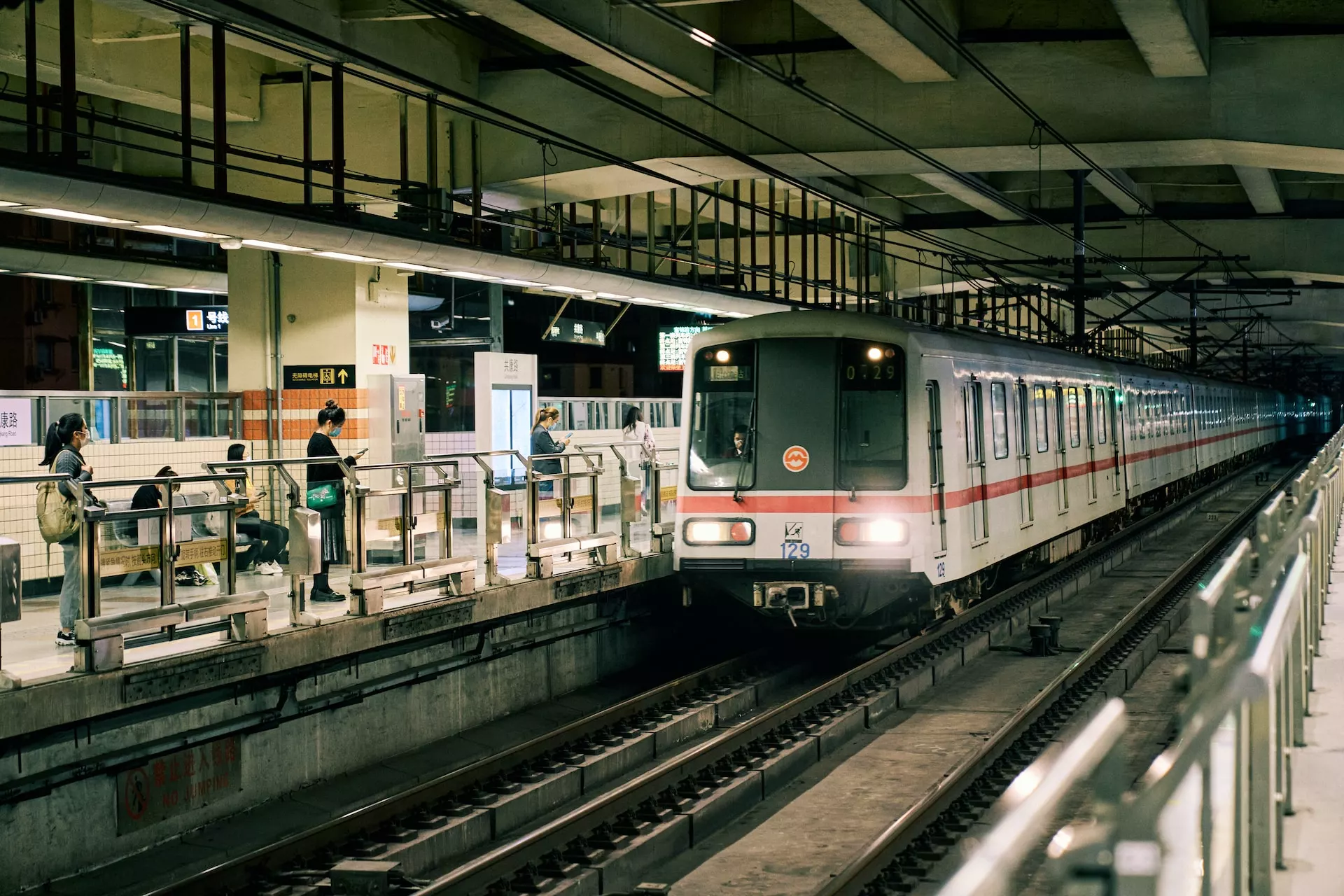 a subway train pulling into a train station